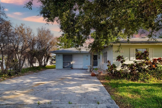 1921 Fairview Dr, Englewood, FL 34223 - view of front of house featuring stucco siding and concrete driveway