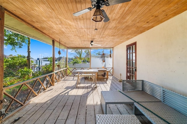 1921 Fairview Dr, Englewood, FL 34223 - deck with outdoor dining area, ceiling fan, and french doors