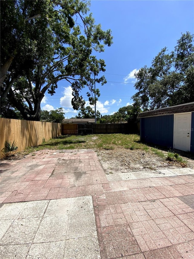 1947 Los Lomas Dr, Clearwater, FL 33763 - fenced backyard featuring a patio area and an outbuilding