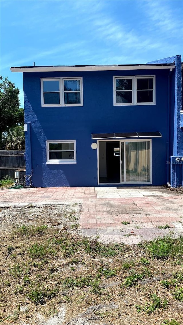 1947 Los Lomas Dr, Clearwater, FL 33763 - rear view of house with a patio, stucco siding, and cooling unit