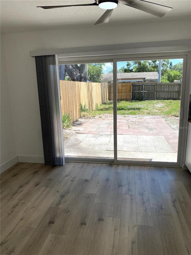 1947 Los Lomas Dr, Clearwater, FL 33763 - unfurnished room featuring ceiling fan, wood finished floors, and baseboards