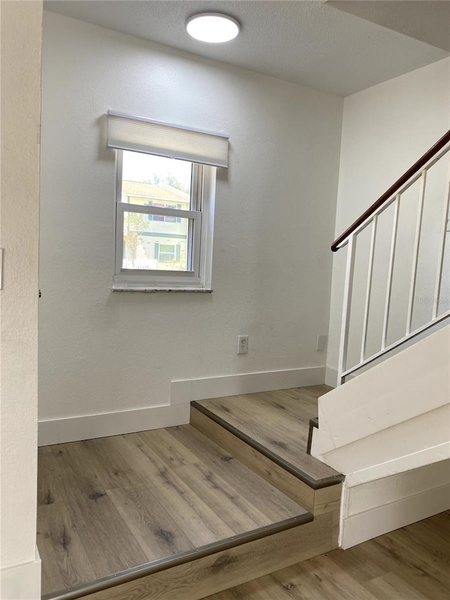 1947 Los Lomas Dr, Clearwater, FL 33763 - staircase featuring wood finished floors and baseboards