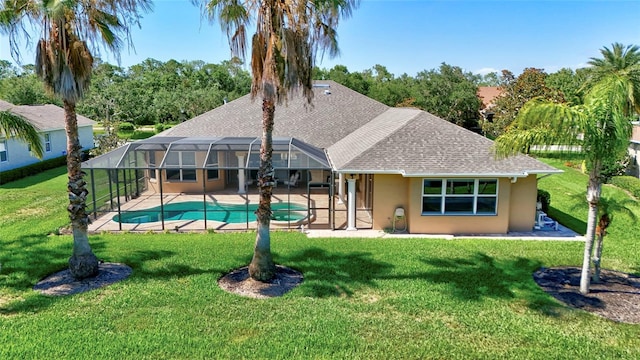 15006 21st Ave E, Bradenton, FL 34212 - back of property featuring a patio, an outdoor pool, stucco siding, a yard, and a shingled roof