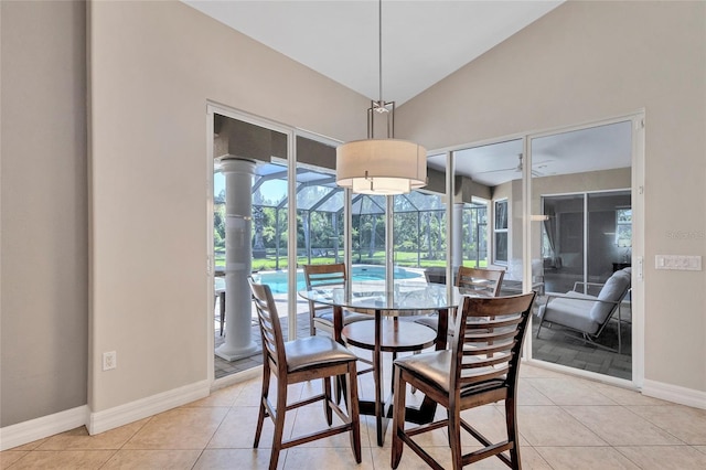 15006 21st Ave E, Bradenton, FL 34212 - dining space with a sunroom, lofted ceiling, baseboards, and light tile patterned floors