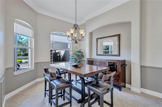 15006 21st Ave E, Bradenton, FL 34212 - dining area featuring plenty of natural light, crown molding, light tile patterned flooring, and a chandelier