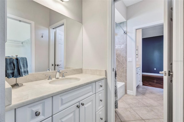 15006 21st Ave E, Bradenton, FL 34212 - full bathroom featuring vanity, tile patterned floors, a walk in closet, tub / shower combination, and baseboards