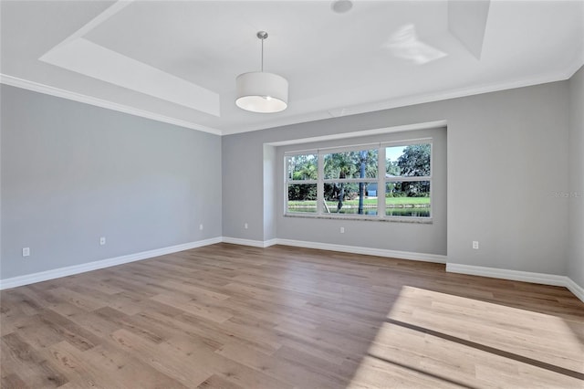 15006 21st Ave E, Bradenton, FL 34212 - empty room featuring ornamental molding, wood finished floors, and baseboards