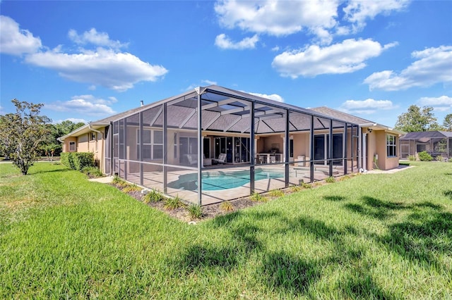 15006 21st Ave E, Bradenton, FL 34212 - rear view of property with a yard, an outdoor pool, stucco siding, and a patio