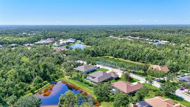 15006 21st Ave E, Bradenton, FL 34212 - aerial view of property and surrounding area with a heavily wooded area, a large body of water, and nearby suburban area