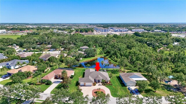 15006 21st Ave E, Bradenton, FL 34212 - aerial view of property's location with a nearby body of water and a tree filled landscape