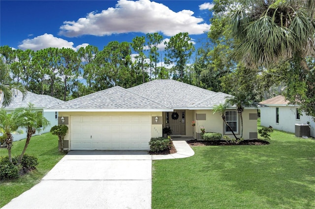 4811 69th Ct E, Palmetto, FL 34221 - single story home featuring stucco siding, an attached garage, driveway, a shingled roof, and a front lawn