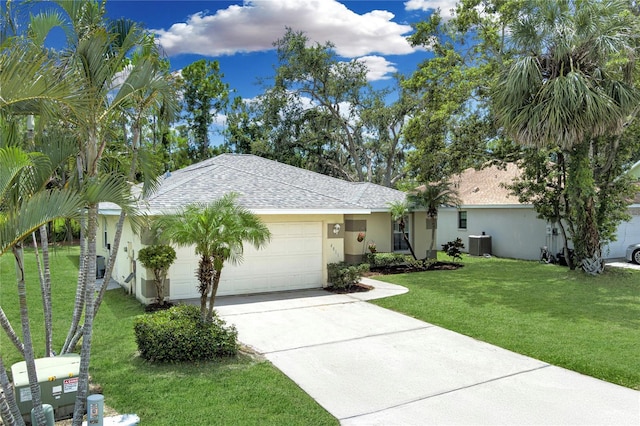 4811 69th Ct E, Palmetto, FL 34221 - ranch-style home with an attached garage, concrete driveway, stucco siding, a front yard, and a shingled roof