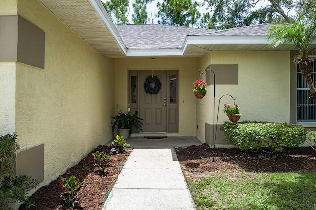 4811 69th Ct E, Palmetto, FL 34221 - property entrance with roof with shingles and stucco siding