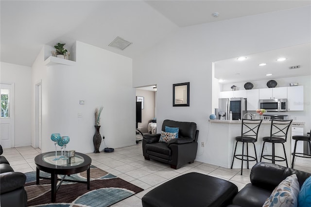 4811 69th Ct E, Palmetto, FL 34221 - living area featuring light tile patterned floors and high vaulted ceiling
