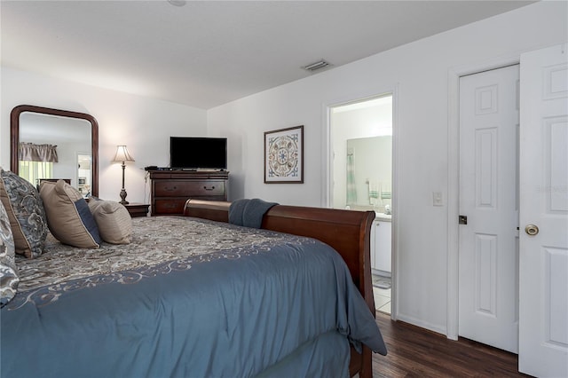 4811 69th Ct E, Palmetto, FL 34221 - bedroom with dark wood finished floors and ensuite bathroom