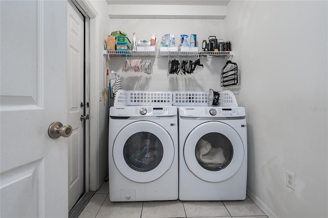4811 69th Ct E, Palmetto, FL 34221 - laundry area with washer and clothes dryer and light tile patterned floors