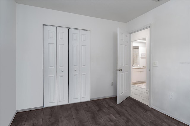 4811 69th Ct E, Palmetto, FL 34221 - unfurnished bedroom with wood finished floors and a closet