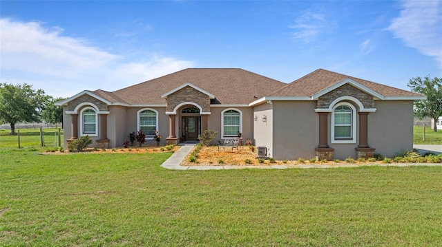 2350 Virgil Hall Rd, Lithia, FL 33547 - view of front facade with stucco siding, a front lawn, and roof with shingles