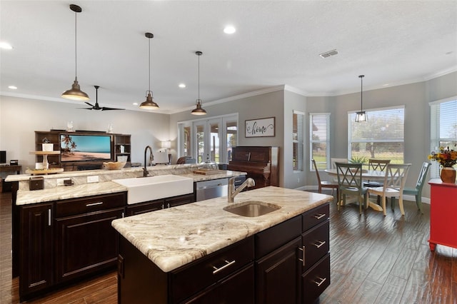 2350 Virgil Hall Rd, Lithia, FL 33547 - kitchen with a sink, an island with sink, open floor plan, recessed lighting, and ornamental molding