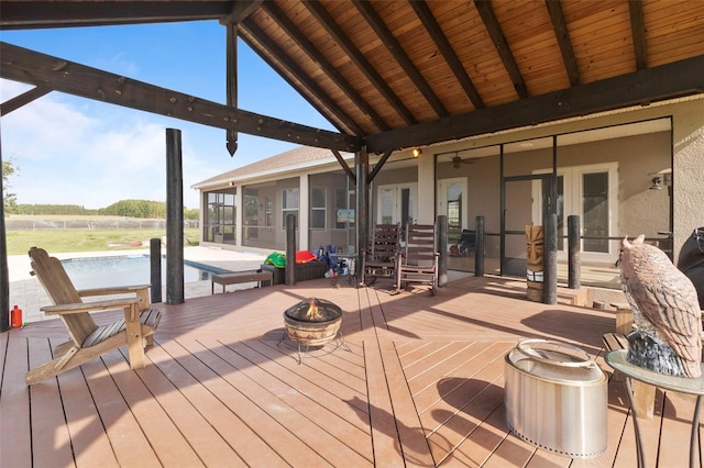 2350 Virgil Hall Rd, Lithia, FL 33547 - deck with a sunroom, an outdoor fire pit, and french doors