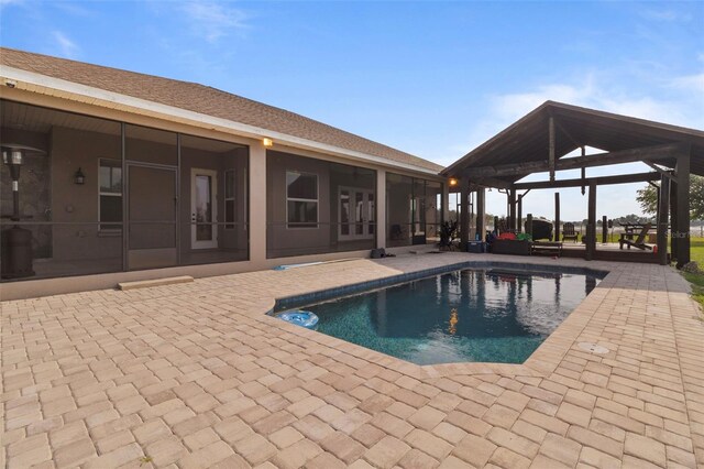 2350 Virgil Hall Rd, Lithia, FL 33547 - swimming pool featuring a gazebo, a patio area, and a sunroom