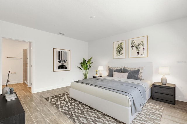 5213 Patano Loop, Palmetto, FL 34221 - bedroom featuring baseboards and wood finish floors