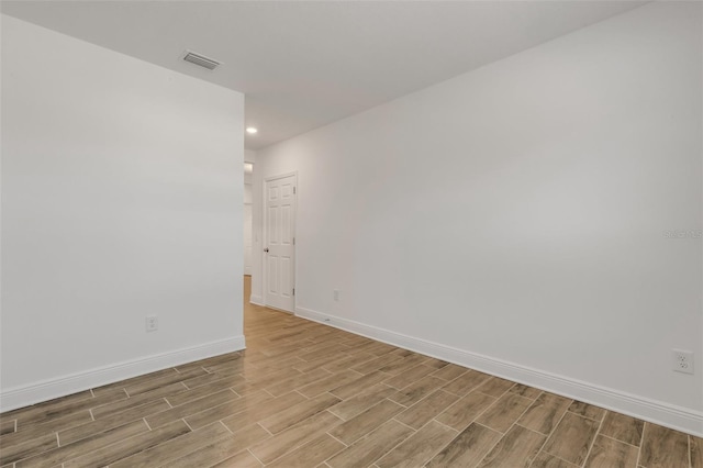 5213 Patano Loop, Palmetto, FL 34221 - unfurnished room with light wood-style flooring, baseboards, and recessed lighting
