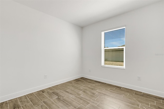 5213 Patano Loop, Palmetto, FL 34221 - unfurnished room with wood finish floors and baseboards