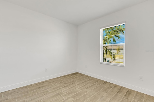 5213 Patano Loop, Palmetto, FL 34221 - spare room with baseboards and wood finish floors