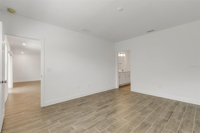 5213 Patano Loop, Palmetto, FL 34221 - empty room with light wood-style flooring, baseboards, and recessed lighting