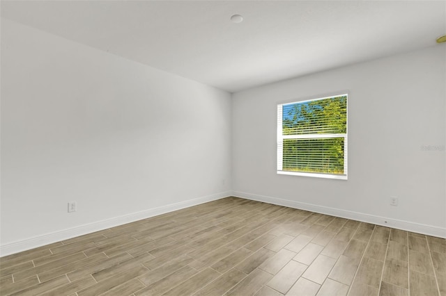 5213 Patano Loop, Palmetto, FL 34221 - empty room with light wood finished floors and baseboards