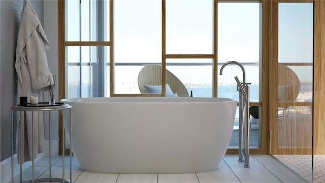 688 Golden Gate Pt Unit 201, Sarasota, FL 34236 - full bath with a freestanding tub and tile patterned floors