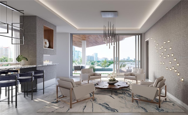688 Golden Gate Pt Unit 201, Sarasota, FL 34236 - living room featuring a view of city, a tray ceiling, and concrete floors