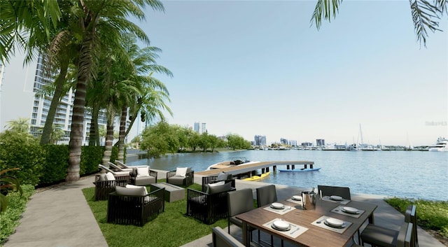 688 Golden Gate Pt Unit 201, Sarasota, FL 34236 - view of patio featuring a water view, an outdoor living space, a boat dock, and outdoor dining space