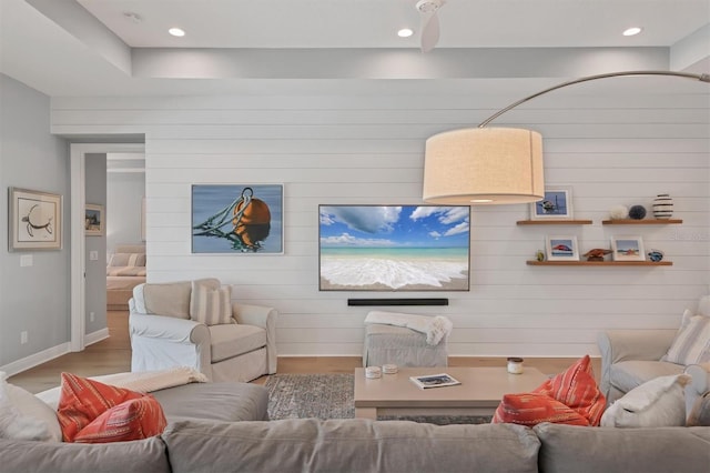 8020 Clearwater Ct, Sarasota, FL 34241 - living room with wood finished floors, baseboards, wooden walls, and recessed lighting