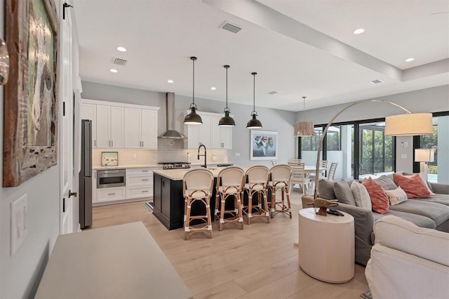 8020 Clearwater Ct, Sarasota, FL 34241 - living area with light wood finished floors and recessed lighting