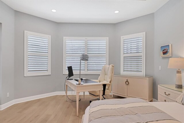 8020 Clearwater Ct, Sarasota, FL 34241 - bedroom with light wood-style floors, baseboards, an office area, and recessed lighting
