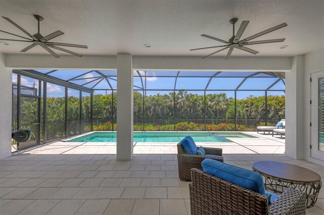 8020 Clearwater Ct, Sarasota, FL 34241 - swimming pool featuring a ceiling fan, a patio, and view of scattered trees