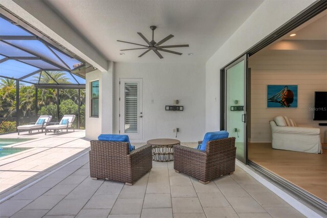 8020 Clearwater Ct, Sarasota, FL 34241 - view of patio featuring ceiling fan, glass enclosure, and an outdoor pool