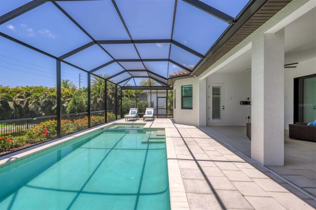 8020 Clearwater Ct, Sarasota, FL 34241 - view of swimming pool with a patio area, a pool with connected hot tub, and glass enclosure