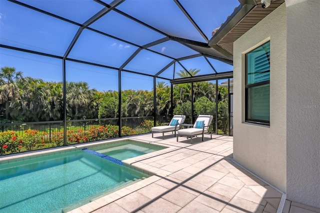 8020 Clearwater Ct, Sarasota, FL 34241 - view of pool featuring a patio, a pool with connected hot tub, and glass enclosure