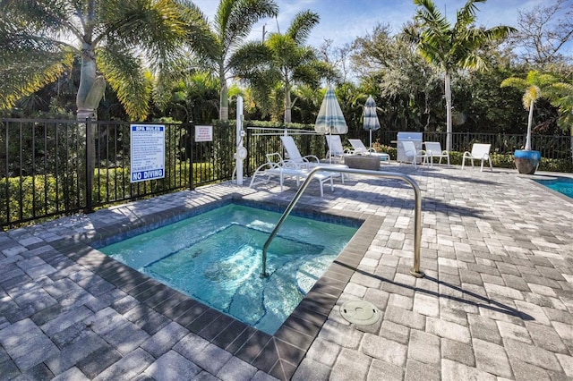 8020 Clearwater Ct, Sarasota, FL 34241 - view of swimming pool with a swimming pool, a community hot tub, and a patio