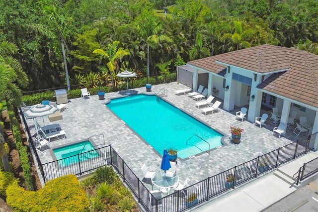 8020 Clearwater Ct, Sarasota, FL 34241 - community pool featuring a patio