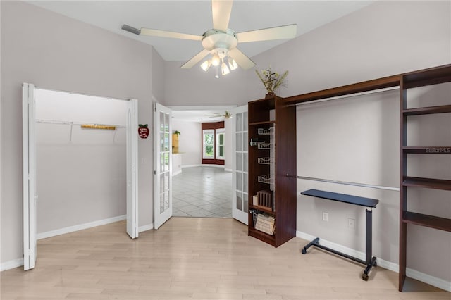 135 Tall Trees Ct, Sarasota, FL 34232 - unfurnished bedroom with a closet, light wood finished floors, french doors, baseboards, and a ceiling fan