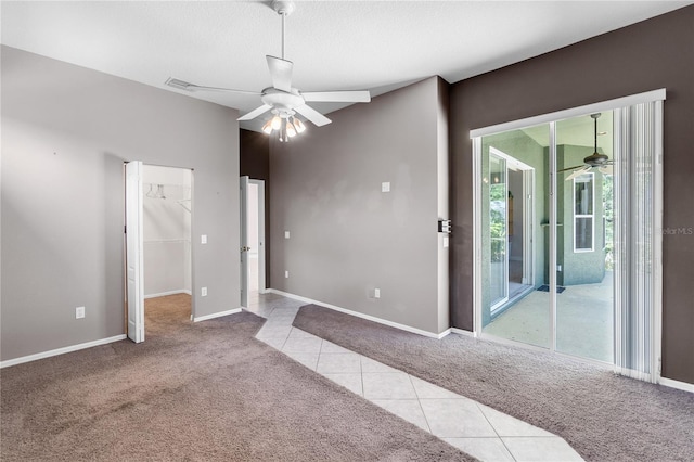 135 Tall Trees Ct, Sarasota, FL 34232 - carpeted empty room featuring a ceiling fan, tile patterned floors, and baseboards