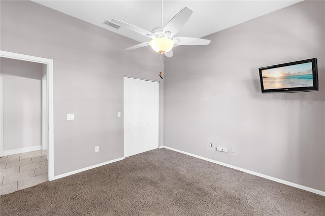 135 Tall Trees Ct, Sarasota, FL 34232 - unfurnished bedroom with carpet floors, baseboards, a ceiling fan, and a closet