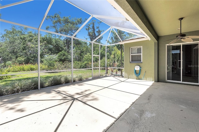 135 Tall Trees Ct, Sarasota, FL 34232 - view of patio / terrace with ceiling fan, glass enclosure, and view of wooded area