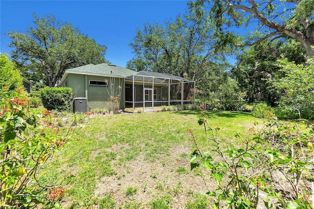 135 Tall Trees Ct, Sarasota, FL 34232 - view of grassy yard with glass enclosure