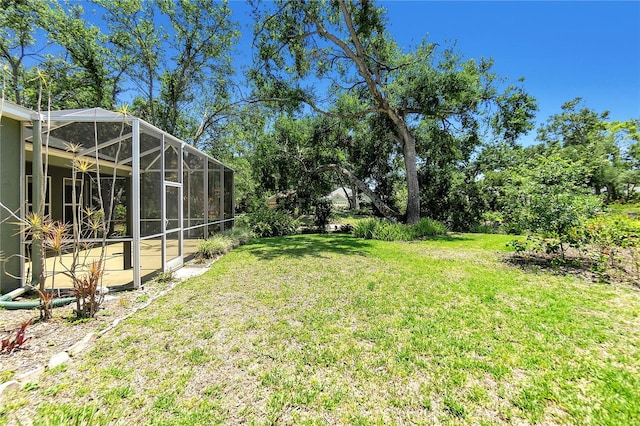 135 Tall Trees Ct, Sarasota, FL 34232 - view of grassy yard featuring glass enclosure