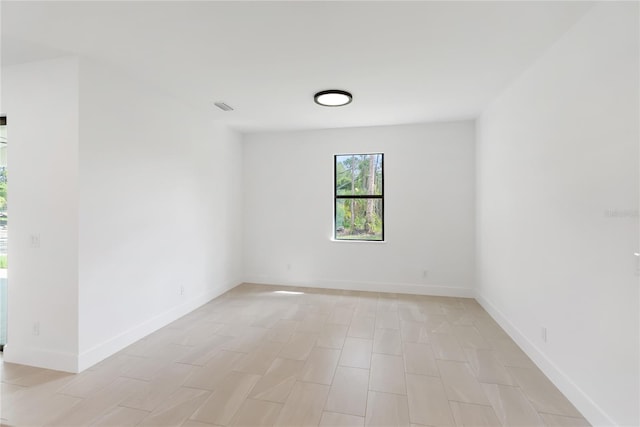 2638 Hagerick Ln, North Port, FL 34288 - spare room with baseboards